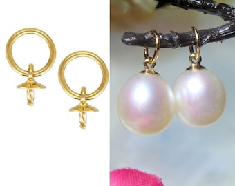 May include: A pair of gold-tone earring findings with a twisted post and a round loop. The findings are shown with a pair of white pearl earrings.
