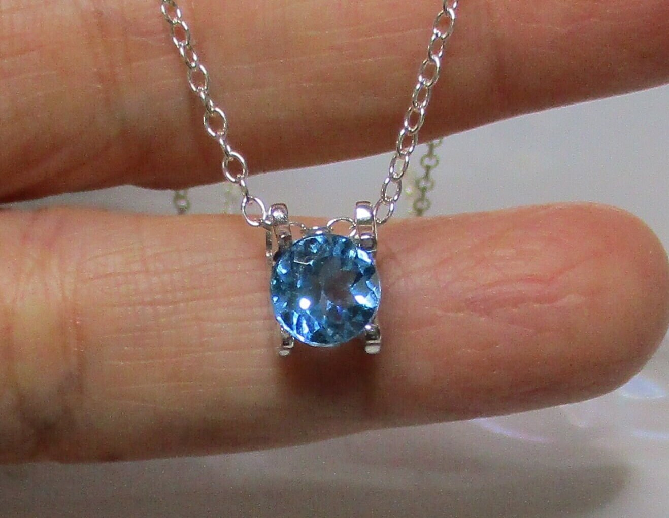 AAA 7mm Natural Swiss Blue Topaz Round Brilliant Cut Sterling