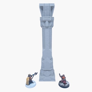 May include: A tall, light gray, architectural pillar with intricate detailing, flanked by two miniature figurines. The pillar features a textured surface and geometric designs, suggesting a fantasy or historical theme. The figurines add a sense of scale and narrative to the scene.