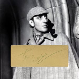 Página do álbum autografado por Basil Rathbone Sherlock Holmes