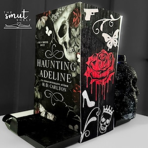 Haunting and Hunting Adeline by H.D. Carlton with custom sprayed edges.