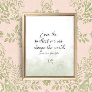 May include: A framed print with a white background and a green watercolor wash. The print features a quote from Beatrix Potter's Peter Rabbit: "Even the smallest one can change the world."