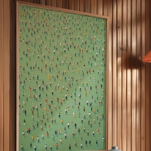 May include: A framed print of a green field with hundreds of tiny people in various colors and poses. The print is hanging on a wood panel wall.