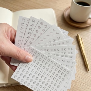 May include: A distressed wooden sign, reading "Welcome to our home" in white. The sign has a rustic finish, ideal for adding a welcoming touch to a front door or hallway.