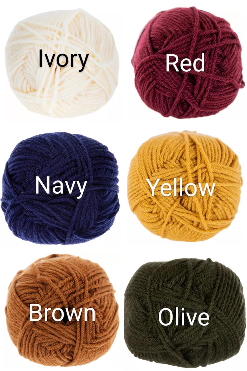 May include: Six balls of yarn in different colors: ivory, red, navy, yellow, brown, and olive. Each ball has the color name written on it.