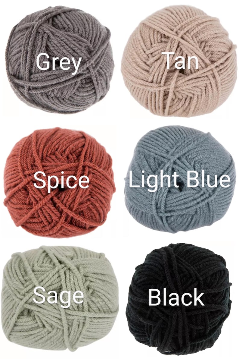 May include: Six balls of yarn in different colors: grey, tan, spice, light blue, sage, and black.