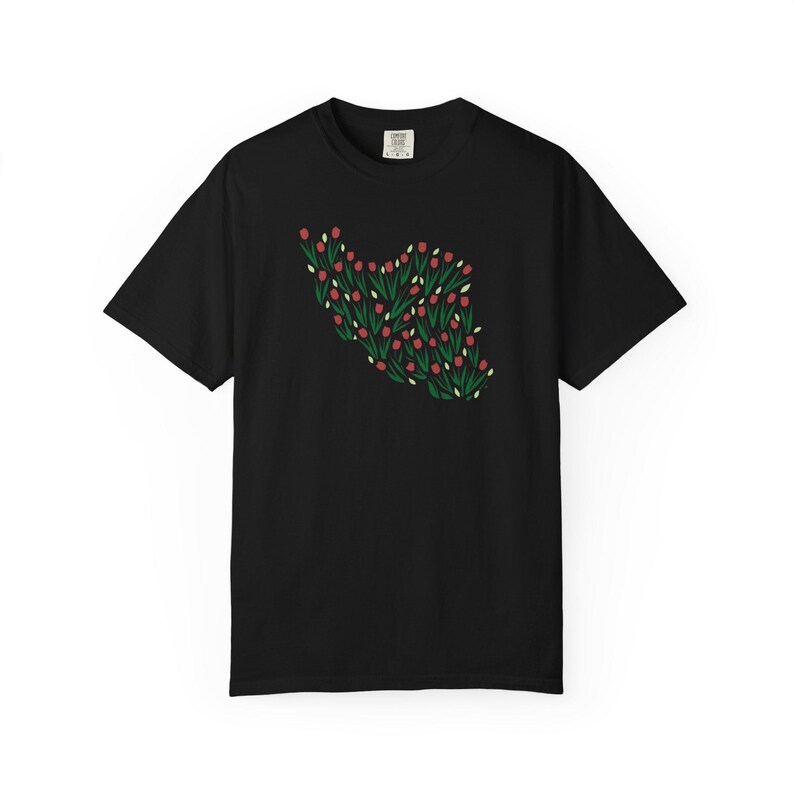 May include: Black t-shirt featuring a floral design in the shape of a heart. The design includes red flowers, green leaves, and white accents. The shirt is a classic crew neck style.