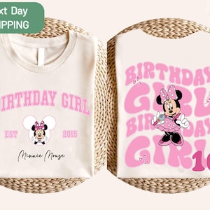 May include: Cream-colored t-shirt with a pink "BIRTHDAY GIRL" design and a Minnie Mouse graphic. The front of the shirt has the text "EST 2015" and "Minnie Mouse". The back of the shirt has the text "BIRTHDAY GIRL 10".