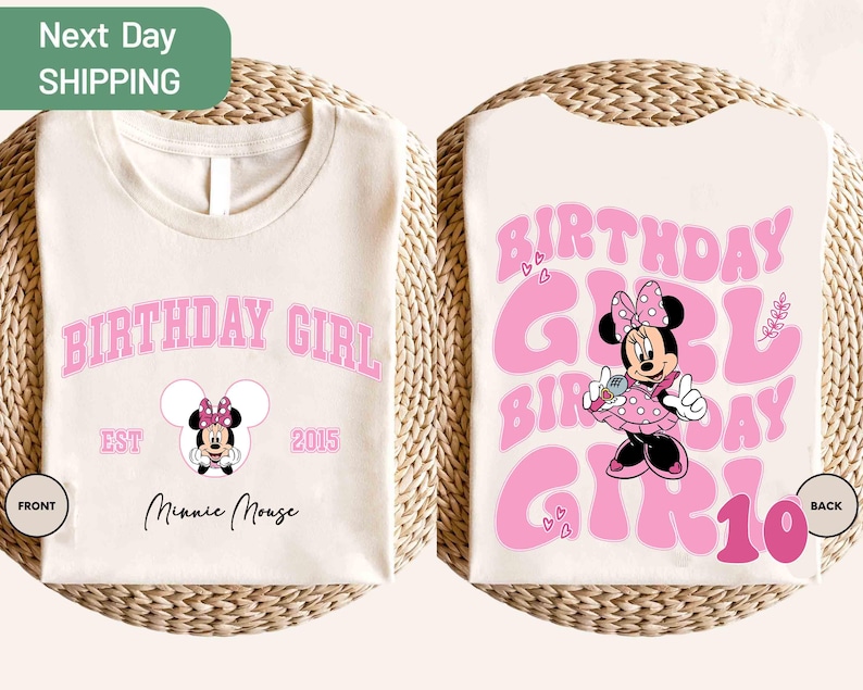May include: Cream-colored t-shirt with a pink "BIRTHDAY GIRL" design and a Minnie Mouse graphic. The front of the shirt has the text "EST 2015" and "Minnie Mouse". The back of the shirt has the text "BIRTHDAY GIRL 10".