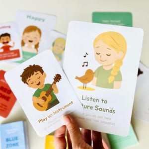 May include: Two illustrated cards with calming activities. The first card shows a person playing a guitar with the text "Play an Instrument. Play soft sounds and let your feelings flow like music." The second card shows a person listening to a bird with the text "Listen to Nature Sounds. Nature sounds can help relax and feel peaceful."