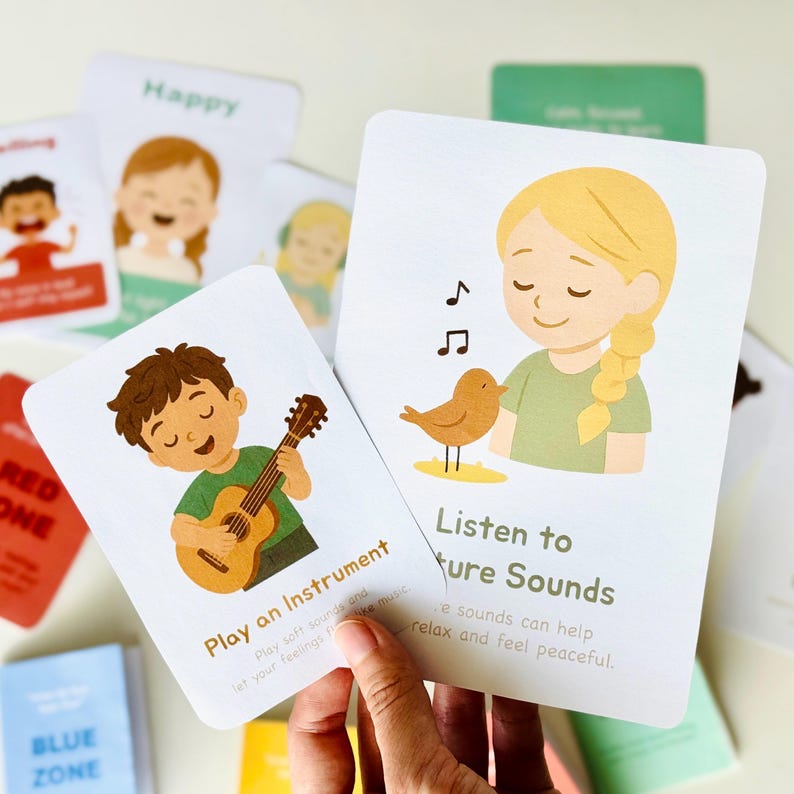 May include: Two illustrated cards with calming activities. The first card shows a person playing a guitar with the text "Play an Instrument. Play soft sounds and let your feelings flow like music." The second card shows a person listening to a bird with the text "Listen to Nature Sounds. Nature sounds can help relax and feel peaceful."