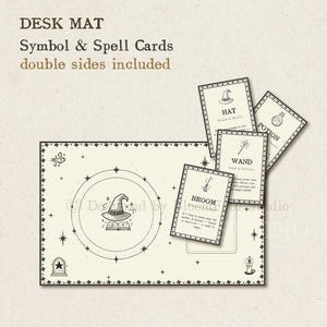 May include: A black and white desk mat with a witch's hat and book in a circle in the center. There are five cards with illustrations and text, including a hat, wand, potion, and broom.