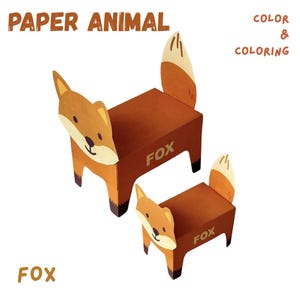 May include: Two paper fox models, one large and one small, are displayed against a white background. The foxes are brown with cream-colored accents and black details. Text on the image reads "PAPER ANIMAL", "COLOR & COLORING", and "FOX".
