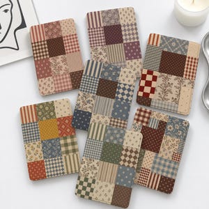 May include: Six rectangular passport holders featuring a patchwork design. Each holder displays a unique arrangement of fabric-like squares in various patterns, including floral prints, gingham checks, stripes, and polka dots in muted earth tones.