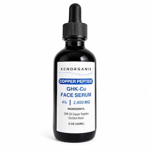 May include: A black glass dropper bottle containing Xenorganix Copper Peptide GHK-Cu face serum. The white label displays the brand name, product name, 4% concentration, 2,400 mg, ingredients list, and a volume of 2 oz (60 ml) in black and blue text.