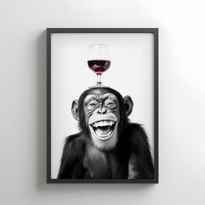 May include: Framed monochrome print of a chimpanzee with a large smile, a glass of red wine balanced on its head. The image is set against a white background, creating a striking contrast.