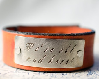 We're All Mad Here-  Alice in Wonderland -  Adjustable Leather Snap Cuff with Engraved Metal Plate
