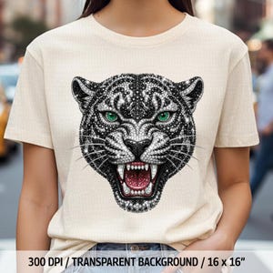 May include: Beige t-shirt featuring a detailed, jeweled tiger head design. The tiger has green eyes, a snarling mouth with visible teeth, and a black and white pattern. The text at the bottom reads "300 DPI / TRANSPARENT BACKGROUND / 16 x 16".