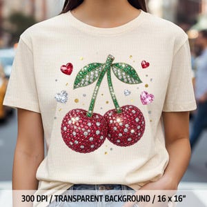 Może przedstawiać: Kremowy t-shirt z błyszczącym wzorem wiśni. Wiśnie są czerwone z białymi akcentami, zielonymi liśćmi i łodygą. Projekt zawiera akcenty w kształcie serc i diamentów. Tekst na dole brzmi "300 DPI / TRANSPARENT BACKGROUND / 16 x 16".