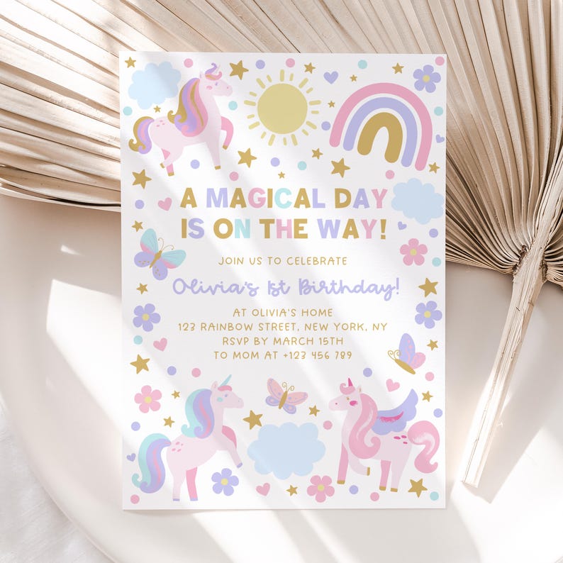 Puede incluir: Una invitaci&oacute;n blanca con un arco&iacute;ris, estrellas, nubes, mariposas y unicornios. El texto dice "A Magical Day Is On The Way! Join Us To Celebrate Olivia's 1st Birthday! At Olivia's Home 123 Rainbow Street, New York, NY RSVP By March 15th To Mom At +123 456 789"