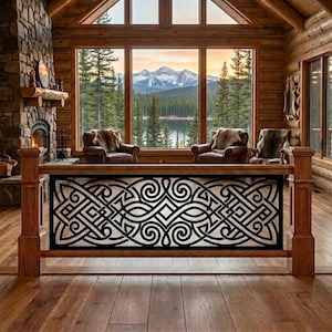 May include: A wooden railing featuring a black metal insert with an intricate, repeating Celtic-inspired knotwork pattern. The railing is constructed from warm-toned wood with vertical posts and a horizontal top rail, framing a view of a cabin interior.