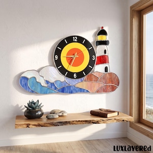 May include: A wall clock featuring a circular face with a yellow and orange center, surrounded by a black border with white numbers. The clock is integrated into a stained glass scene depicting a lighthouse, blue ocean waves, and rocks.