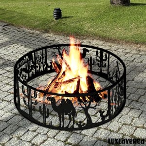 May include: A black metal fire pit with a desert scene cut-out design, including cacti, trees, and a camel. The fire pit is filled with burning wood, creating a warm glow. The fire pit is on a stone patio.
