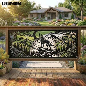 May include: A black metal decorative railing panel featuring a laser-cut design of a wolf standing on a rocky cliff, howling at a crescent moon, surrounded by pine trees and mountain peaks. The text LUxLAYERED is visible in the top left corner.