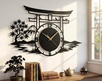 May include: A black wall clock featuring a silhouette of a torii gate, a mountain, and a tree. The clock face has gold hands and numbers at the 3, 6, 9, and 12 positions. The design is mounted on a wall above a shelf with books and a bonsai.