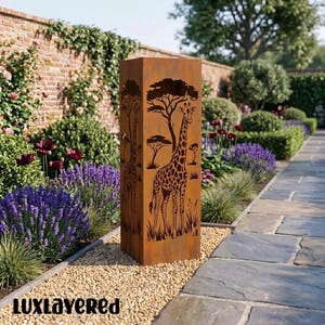 May include: A rectangular, weathered metal garden sculpture with a giraffe and savanna tree design. The sculpture is set in a garden with flowers and a brick wall. The text "luxlayered" is at the bottom.