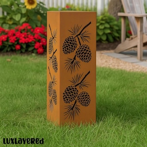 May include: A tall, rectangular, outdoor metal planter with a weathered, rust-colored finish. The planter features a repeating pattern of black pine cone and branch designs. The word "luxlayered" is at the bottom.