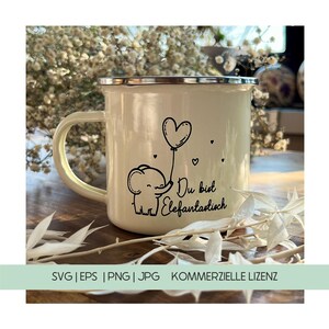 May include: Cream-colored enamel mug with a silver rim and handle. The mug features a black illustration of an elephant holding a heart-shaped balloon, with the German text "Du bist Elefantastisch".