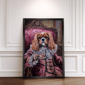 May include: A framed portrait of a Cavalier King Charles Spaniel dressed in antique clothing, holding a teacup. The dog is seated in a pink chair, wearing a ruffled collar and a pink coat. The artwork has a vintage aesthetic.