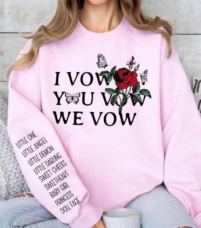 May include: A light pink sweatshirt with the text "I VOW YOU VOW WE VOW" and a red rose graphic with butterflies. The left sleeve has a list of terms including "LITTLE ONE" and "DOLL FACE".