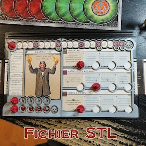 Puede incluir: Un componente de juego de mesa con una carta de personaje de Rasputín, fichas rojas y elementos del juego. La carta presenta un retrato de Rasputín sosteniendo llamas, con texto en francés. El texto "FICHIER STL" está en la parte inferior.
