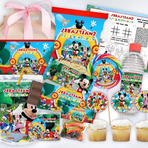 May include: A collection of party supplies featuring Mickey Mouse and friends. Includes a gift bag, juice box, candy, water bottle, cupcakes, and various decorations. The theme is "Sebastian's 1st Birthday" with colorful graphics and text.