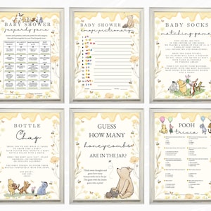 May include: Six framed baby shower games featuring Winnie the Pooh characters. Games include Jeopardy, Emoji Pictionary, Baby Socks Matching, Bottle Chug, Guess How Many Honeycombs, and Pooh Trivia. Each game has a yellow floral border.