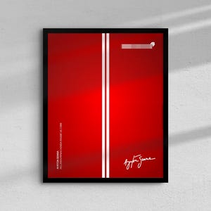 May include: A framed art print with a red gradient background, two vertical white stripes, and the signature "Ayrton Senna." The print also includes text: "AYRTON SENNA MCLAREN MP4/4 HONDA RAISE VS 1988."