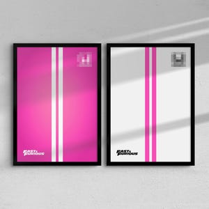 May include: Two framed posters with a racing theme. One is bright pink with white stripes, the other is white with pink stripes. Both have the text "Fast & Furious" at the bottom.