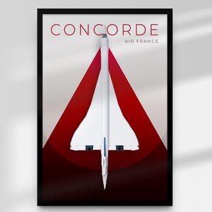 May include: Framed print of a white Concorde aircraft set against a red and grey backdrop. The word "CONCORDE" is in red at the top, with "AIR FRANCE" below. The image is enclosed in a black frame.