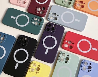May include: Assortment of phone cases in various colors with a built-in magnetic ring holder. The cases are made of silicone and have a raised camera bump for added protection.