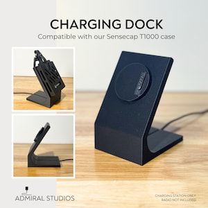 May include: A black charging dock for a Sensecap T1000 case, featuring a slanted stand with a circular magnetic connector. The text reads CHARGING DOCK, Compatible with our Sensecap T1000 case, ADMIRAL STUDIOS, and CHARGING STATION ONLY RADIO NOT INCLUDED.