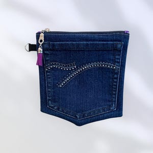 May include: A white ceramic mug with a black handle and the text "But First, Coffee" in a black, bold font. The mug is on a white surface. The mug is 4 inches tall.