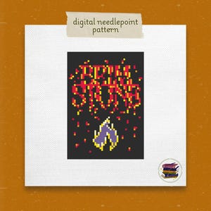 May include: Digital needlepoint pattern featuring the words "Bring Strong" in pixelated red and yellow letters on a black background. Below the text is a pixelated purple and yellow design. The pattern is on a white canvas.