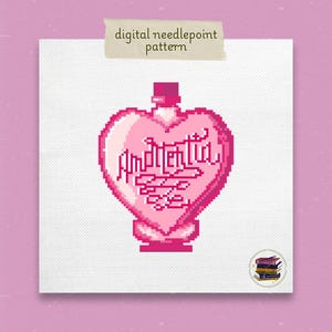 May include: A pink heart-shaped bottle with a red stopper and the text "Amortentia" in a cursive font. The bottle is on a white background.