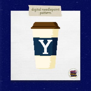 May include: A white coffee cup with a brown lid and a blue band with a white letter Y on it. The cup is on a white background.