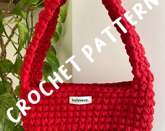 May include: A bright red crochet bag with a rounded shape and a thick handle. The bag has a textured appearance and a small white tag that reads "bylinsey." The words "CROCHET PATTERN" are written in white across the image.