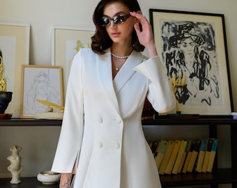 elegant white tailored blazer dress with ruffle detail Prized White Tailored Blazer Dress With Black Bow – Club L London main image 0