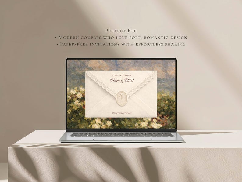 May include: A laptop screen displaying a digital invitation featuring an off-white envelope with lace trim and a wax seal. The text reads A LOVE LETTER FROM Clara & Elliot and OPEN THE INVITATION. The background shows a painting of a floral garden.