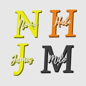 May include: Four colorful wooden letters: yellow "N" with "Nova", orange "H" with "Hale", yellow "J" with "James", and black "M" with "Milo". Each letter has a 3D effect and a cursive name overlay.